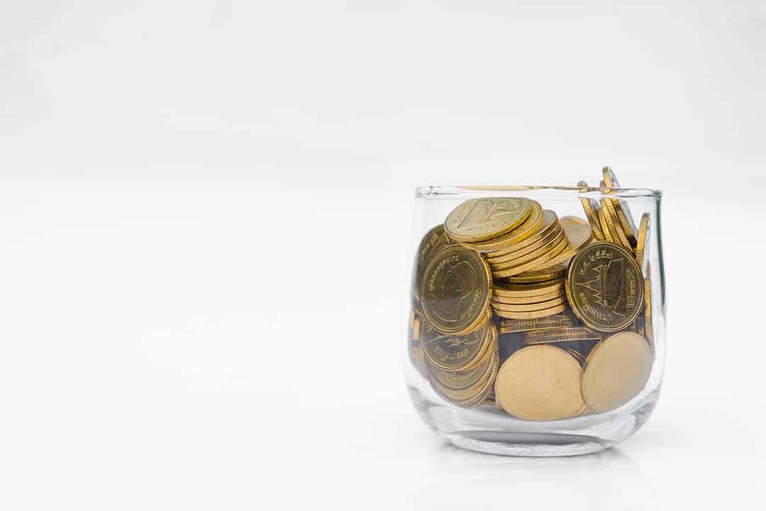 many-gold-coins-glass-white-background (1)
